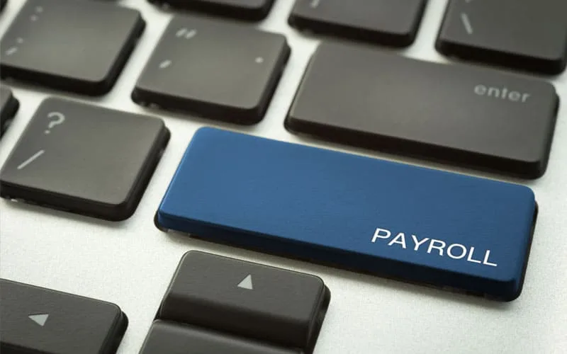 Accounting-Services an image of a keyboard showing a button for payroll as this falls under the remit of accounting and taxation