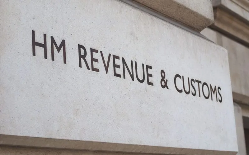 Taxation-Services a printing of the HMRC logo on a building, presumably their headquarters where they deal with taxation services